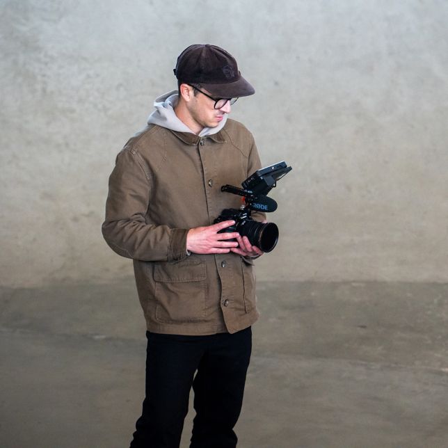 A content creator filming a video with the LUMIX S1II