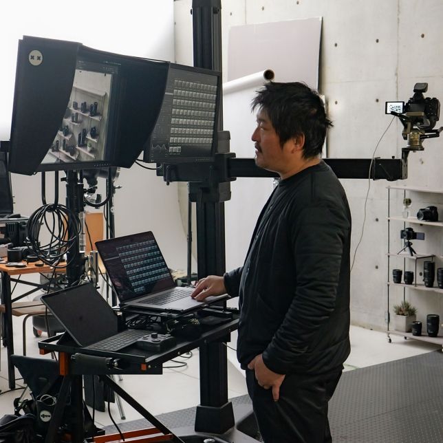 A creator checking a monitor in the studio