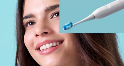Close-up view of the Electric Toothbrush EW-DCA3 alongside a smiling woman