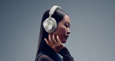Woman wearing Technics EAH-A1000 headphones, introducing the focus on detailed, immersive sound.